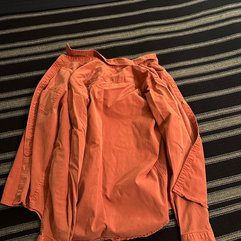 Used but in good condition. One button missing